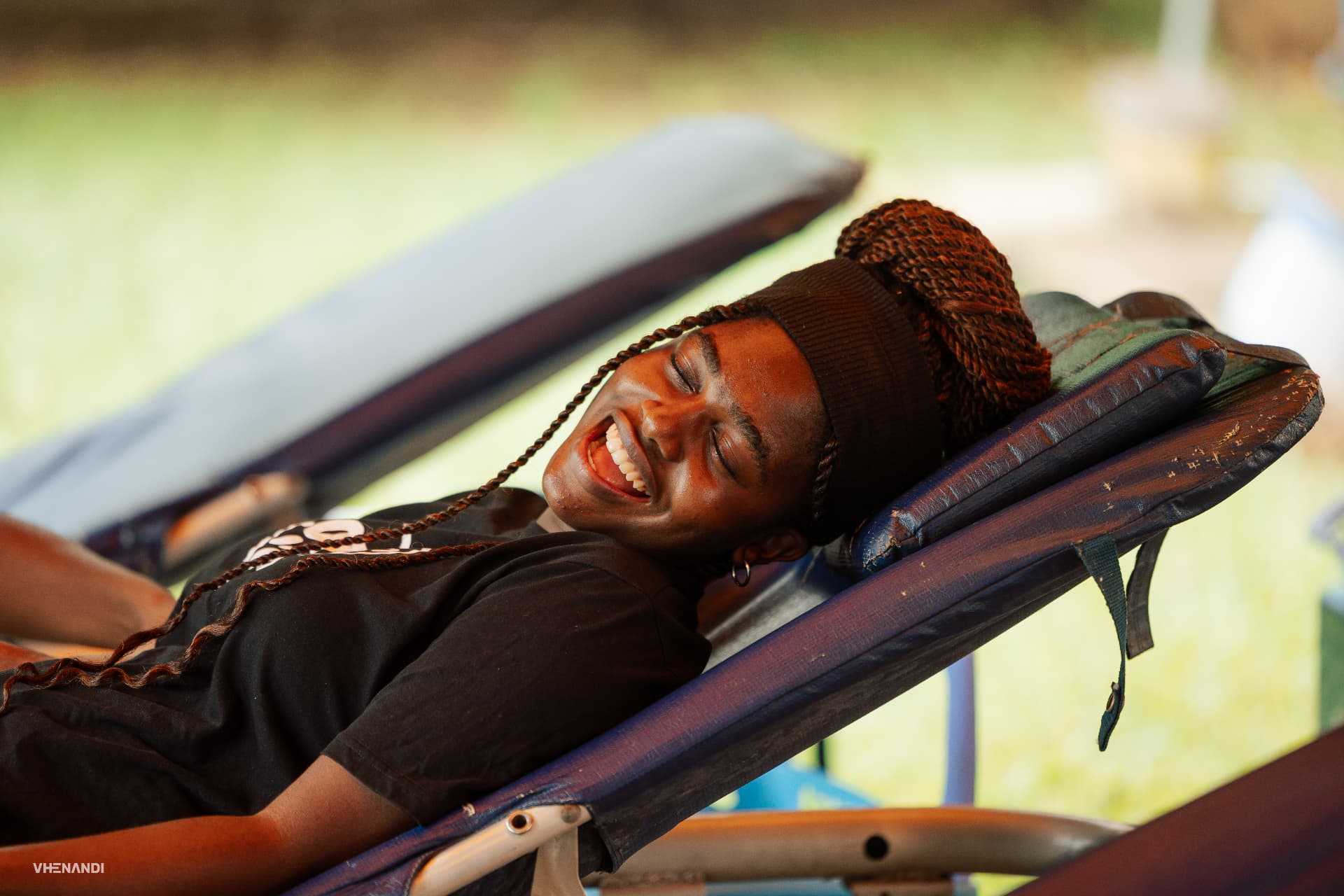 A donor smiling while resting on a donation chair at a Bloodline drive